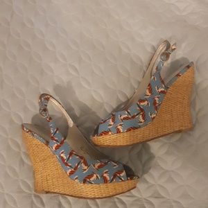 Blue platform sandals with Orange Bird motif
